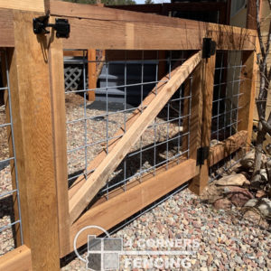 42” tall cedar board fence with 4” x 4” utility mesh paneling. Residential built for small dogs. <br/>© Copyright 4 Corners Fencing, llc