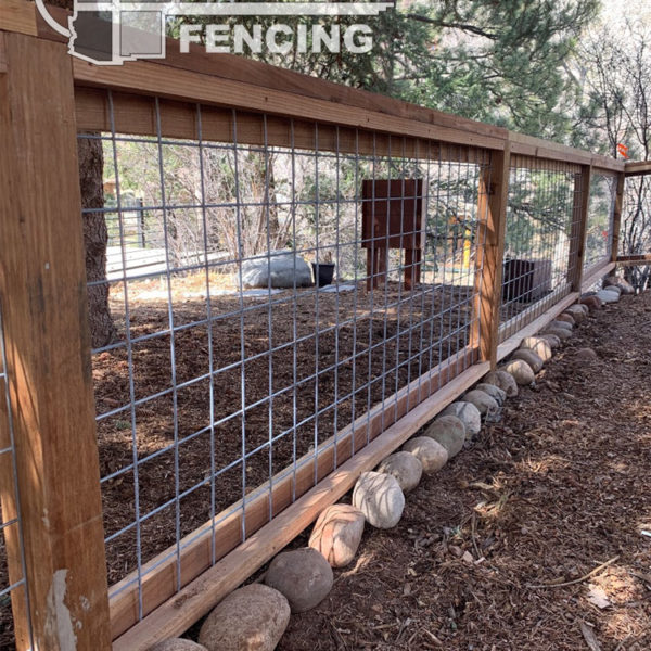 42” tall cedar board fence with 4” x 4” utility mesh paneling. Residential built for small dogs. <br/>© Copyright 4 Corners Fencing, llc